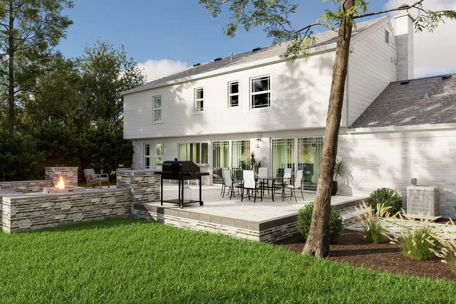 Rendering of the rear elevation with a raised bluestone terrace on a stacked-stone retaining wall